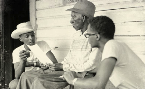 three African-American men talking